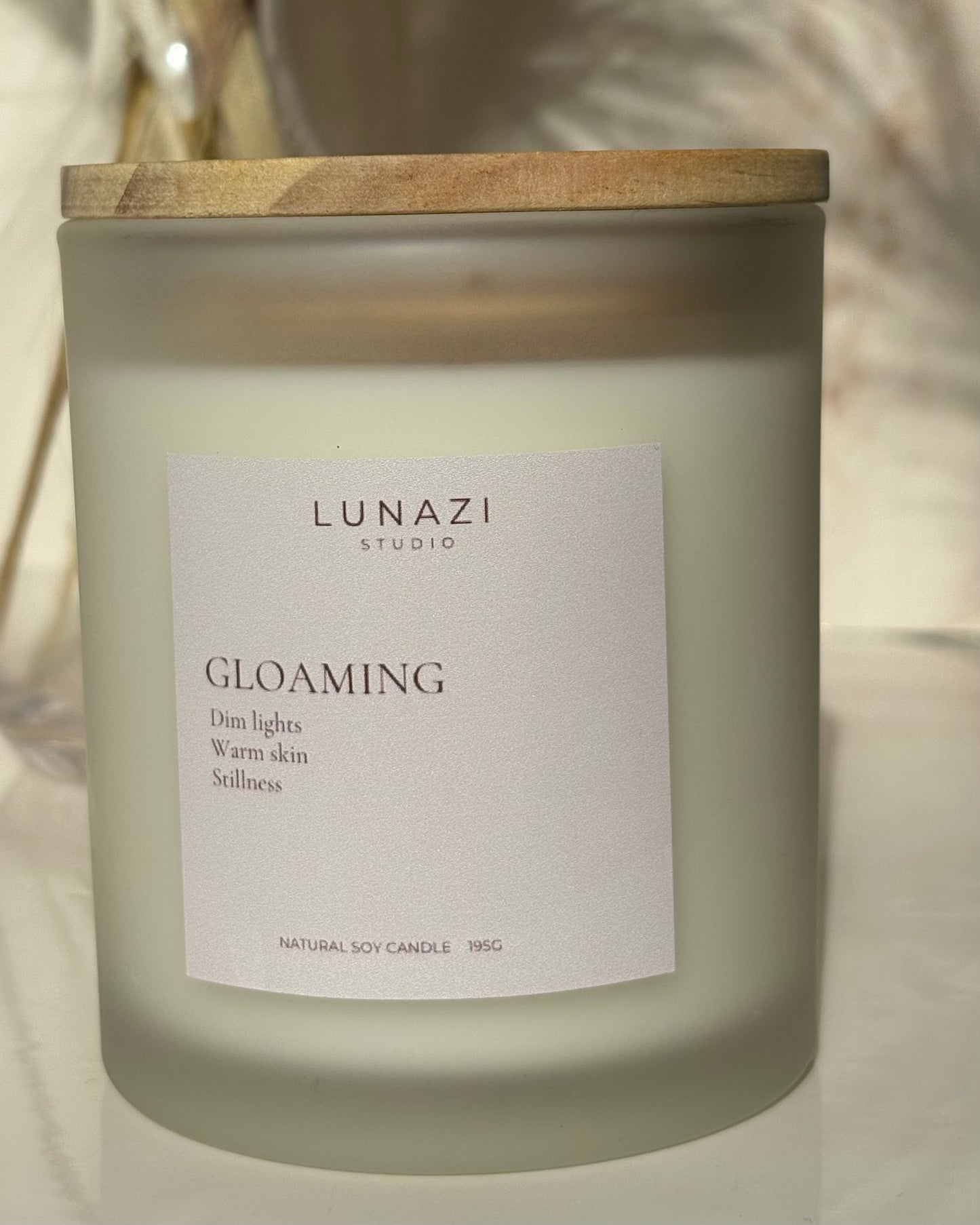 Gloaming Scented Candle by Lunazi Studio – styled candle shot with warm ambient lighting